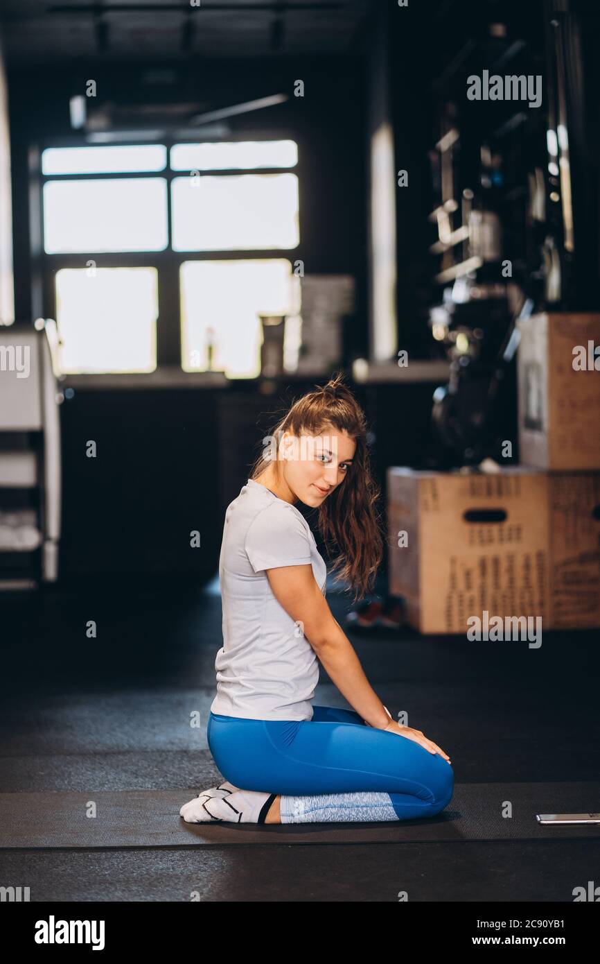 Portrait girl kneeling on floor hi-res stock photography and images - Alamy