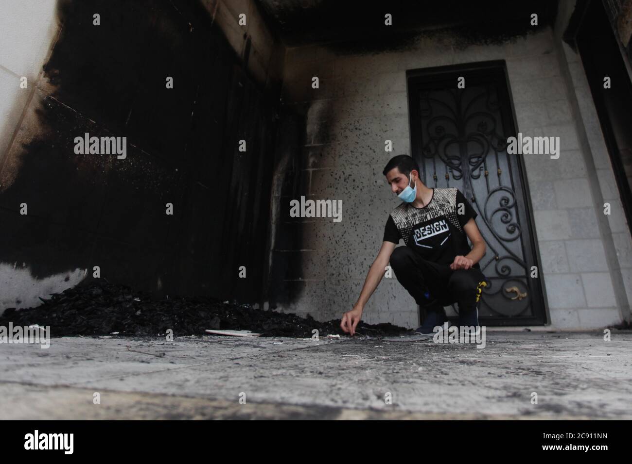 Al Bireh. 28th July, 2020. A Palestinian Checks The Damaged Entrance Of ...