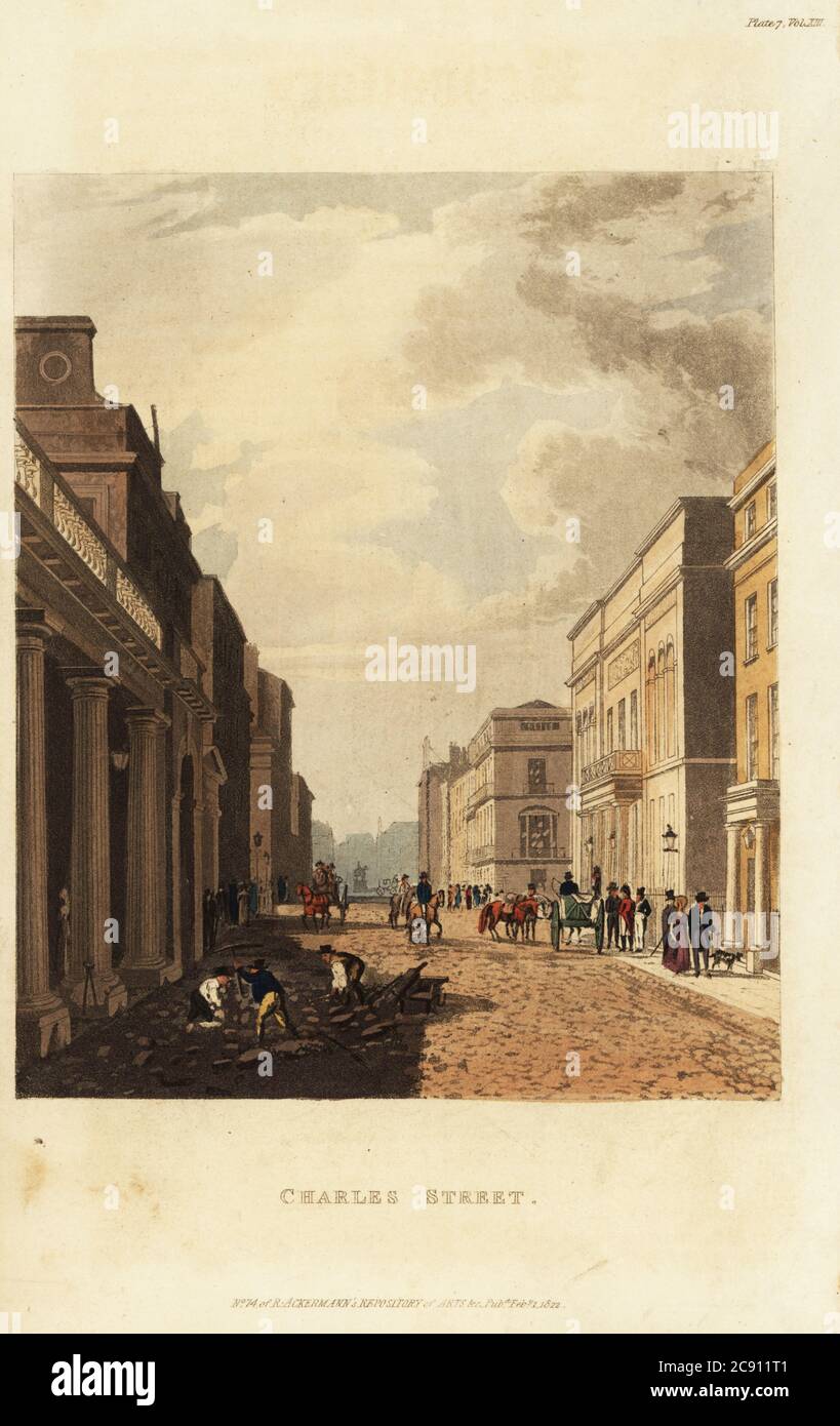 View of Charles Street, looking toward St. James’s Square, London. (Now Charles II Street.) Navvies and paviors repair the cobblestone road, while fashionable pedestrians, coaches and riders pass by. Handcoloured copperplate engraving from Rudolph Ackermann’s Repository of Arts, Literature, Fashions, Manufactures, etc., Strand, London, 1822. Stock Photo