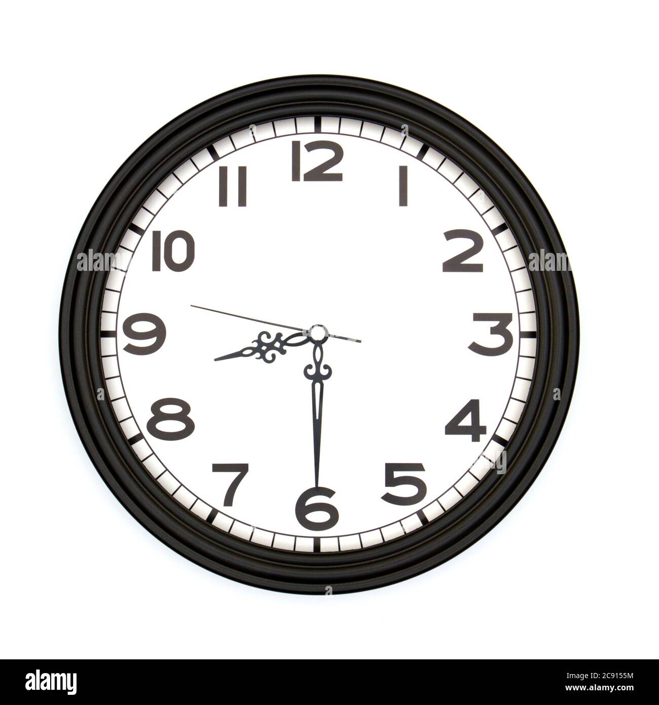 Black round analog wall clock isolated on white background, its half past eight Stock Photo Alamy