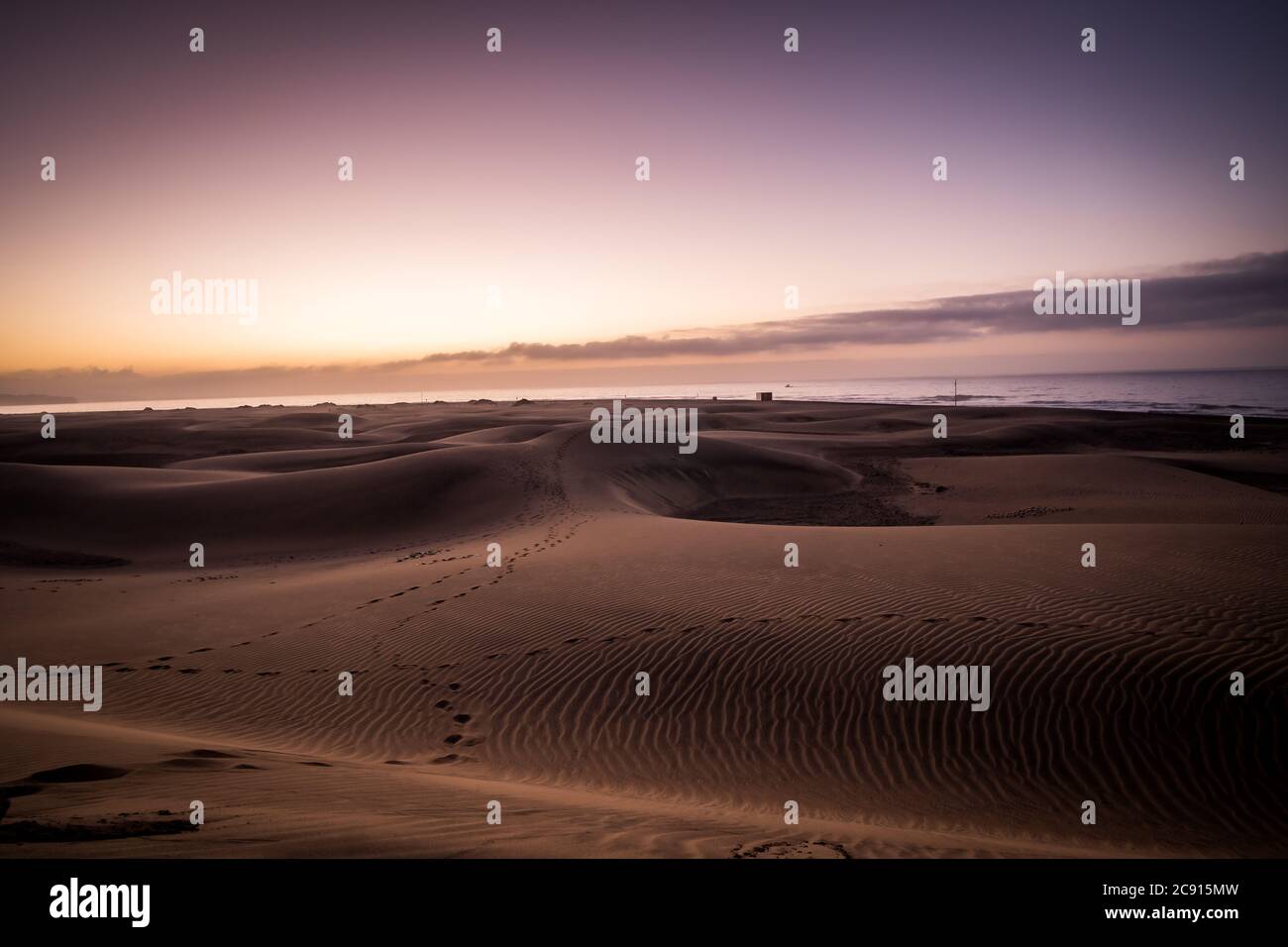 Spectacular Sunrise Sandy dunes in famous natural Maspalomas beach. Gran Canaria. Spain Stock Photo