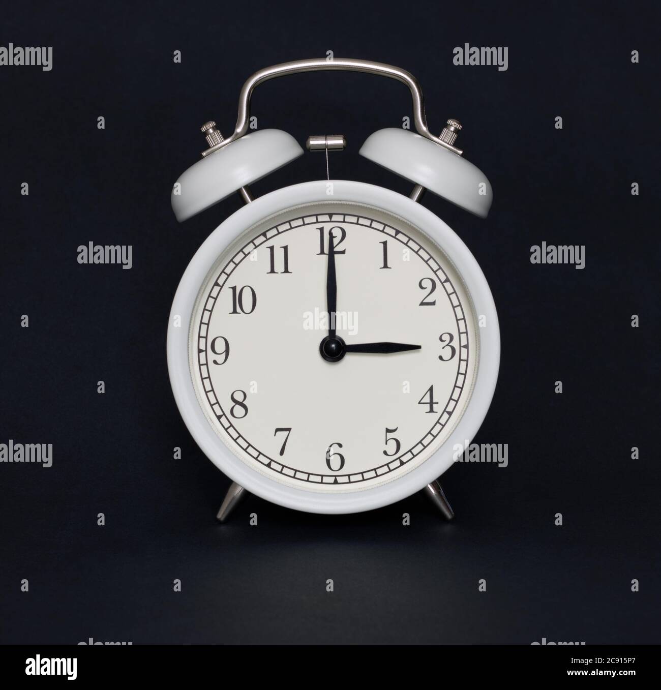 Oldstyle alarm clock, black and white, it's three oclock Stock Photo