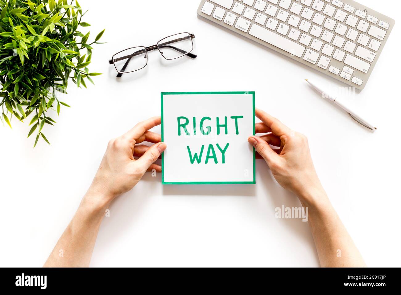 Business desicion. Right way icon in hand on white desk top view Stock ...