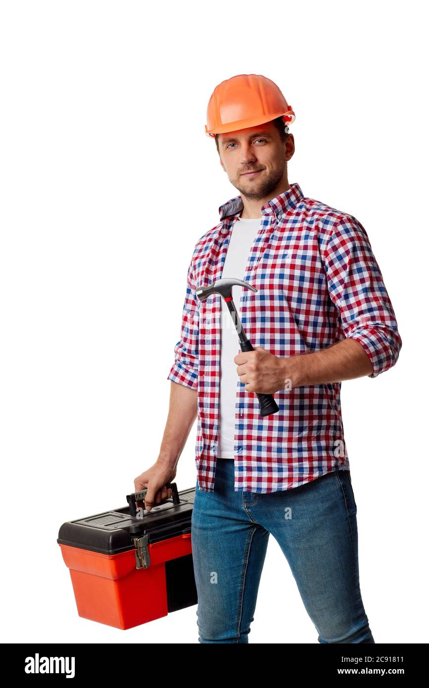 Young caucasian builder worker in yellow hard hat and shirt holding hammer and tool box. handyman wearing tool belt isolated on white studio background Stock Photo