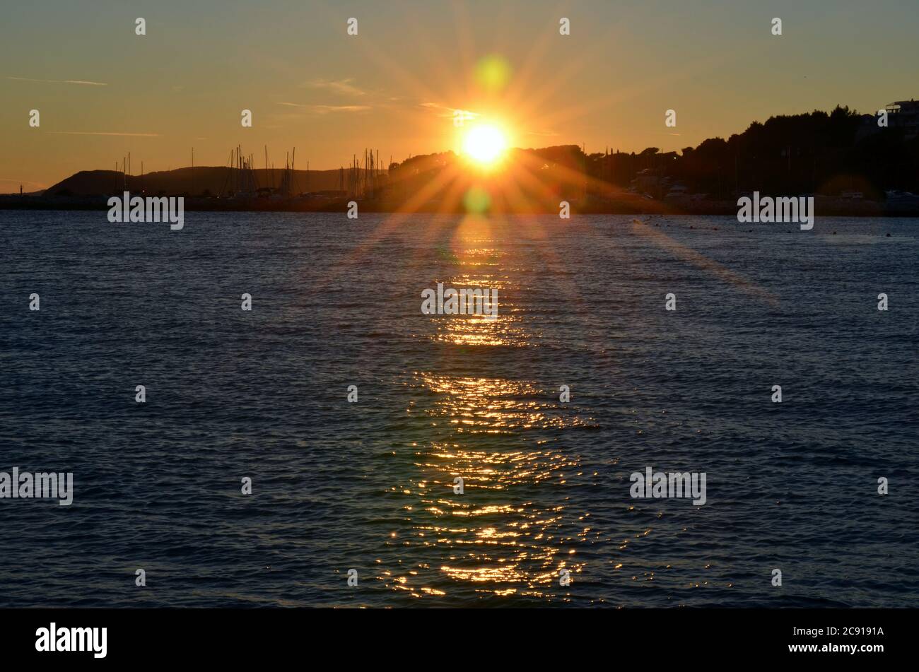 The sun sets over the bay at the end of a beautiful September day in Split, Croatia Stock Photo