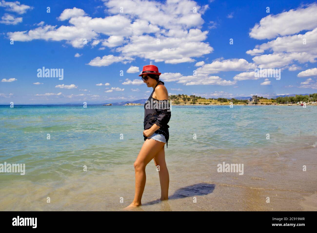 Woman walking beach alone dress hi-res stock photography and images - Alamy