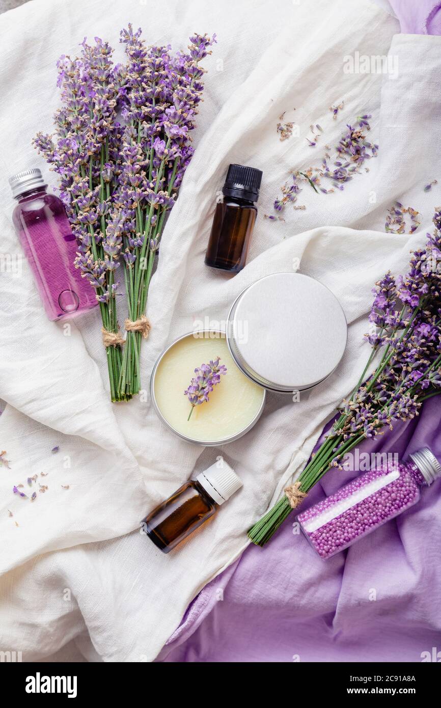 Set lavender skincare cosmetics products. Natural spa beauty products fresh  lavender flowers on white fabric. Lavender essential oil bottle body Stock  Photo - Alamy