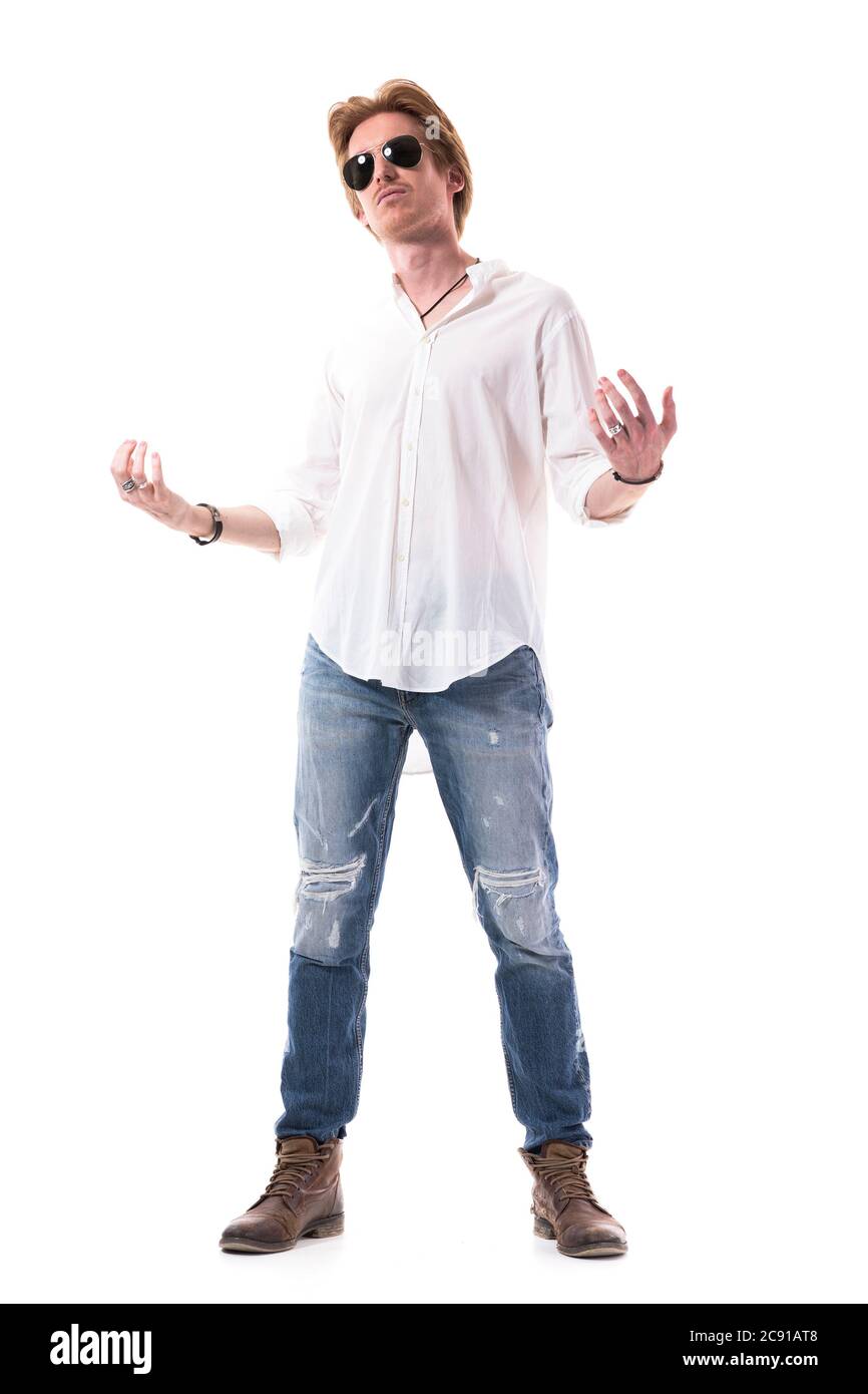 Serious confident macho intimidating man daring and challenging beckoning you looking at camera. Full body length isolated on white background. Stock Photo