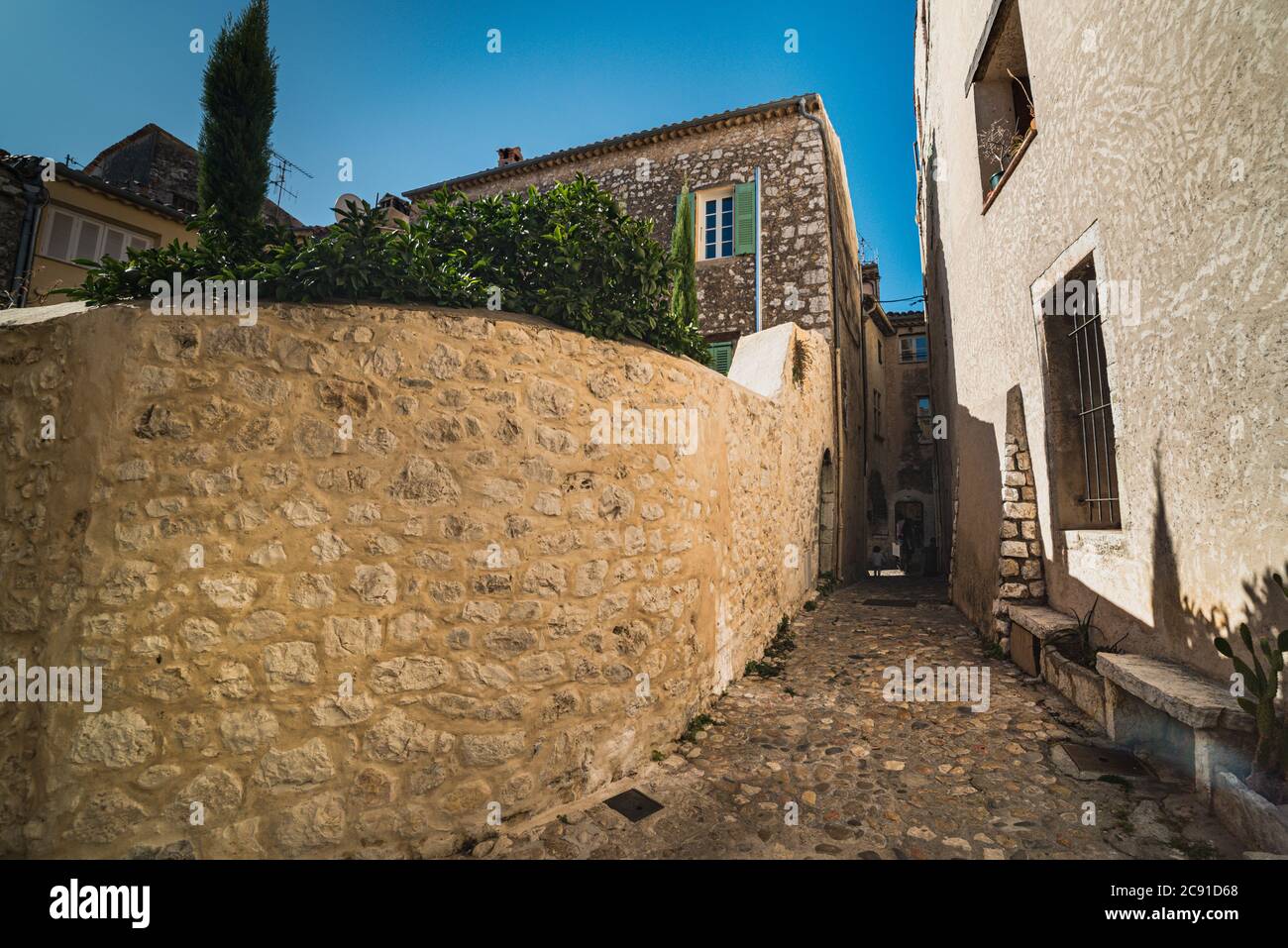 Narrow streets in a medieval town in the countryside convey provincial and rustic concept. Cobbled alleys in a historical village show well off or wea Stock Photo