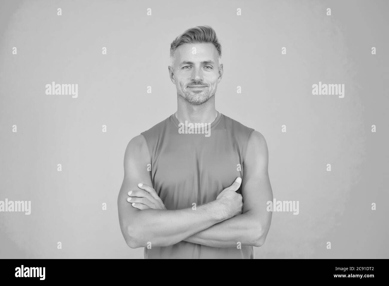 Confident in his strength. Confident look of muscular guy. Confident man keep arms crossed blue background. Athletic type. Confident and healthy. In good shape and health. Stock Photo