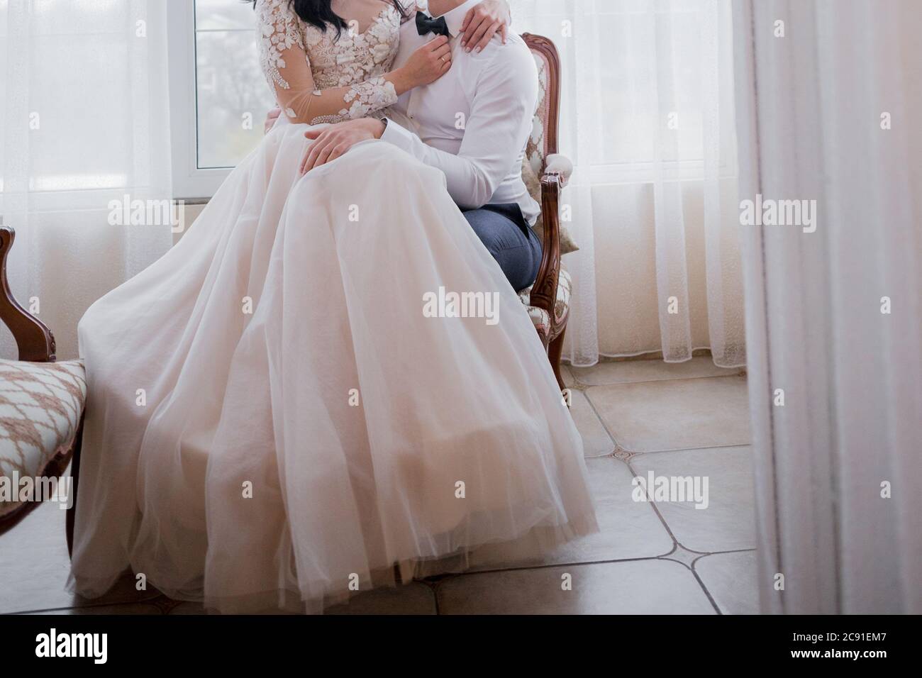 Young groom sitting on bed hi-res stock photography and images - Alamy