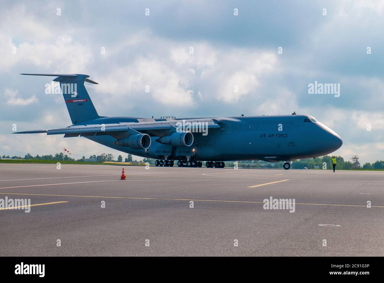 A jumbo C-5 Air Force plane flown by the Air National Guard from West Virginia carrying a load of Strykers lands. On the Tarmac at the Vilnius Interna Stock Photo