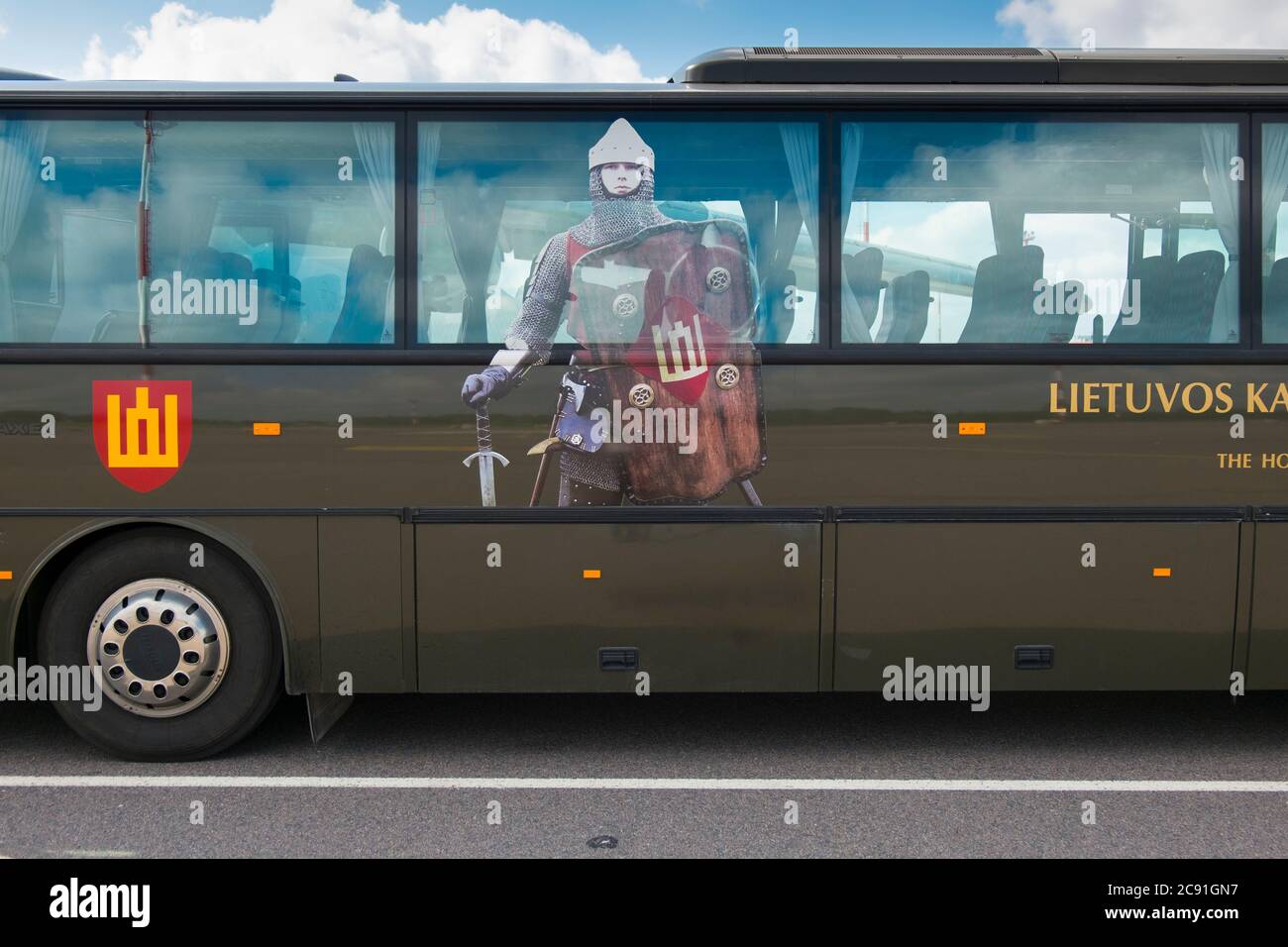 Picture of a Medieval  Lithuanian military fighter on a transport bus.  On the Tarmac at the Vilnius International Airport in Lithuania. Stock Photo