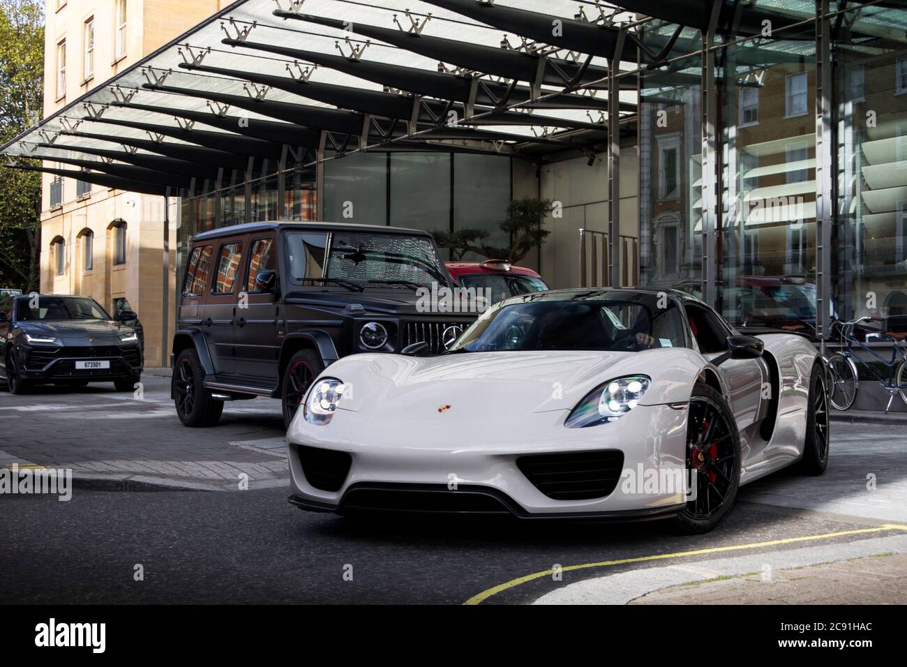 Crayon Grey Porsche 918 Spyder modern supercar driven at a luxury hotel