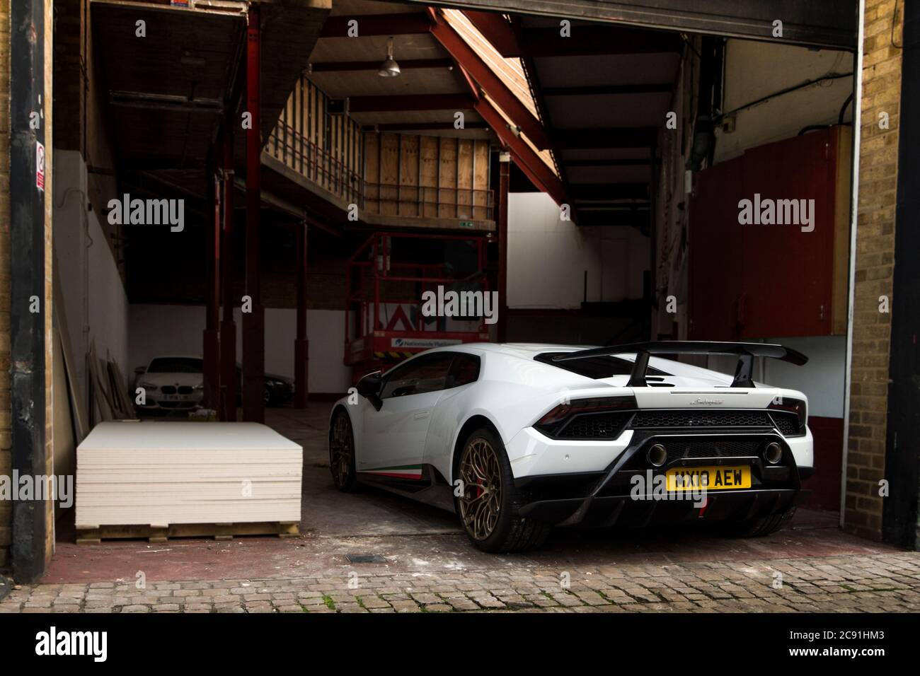 White Lamborghini Huracan Performante modern supercar parked at a warehouse in central Birmingham, UK. Stock Photo