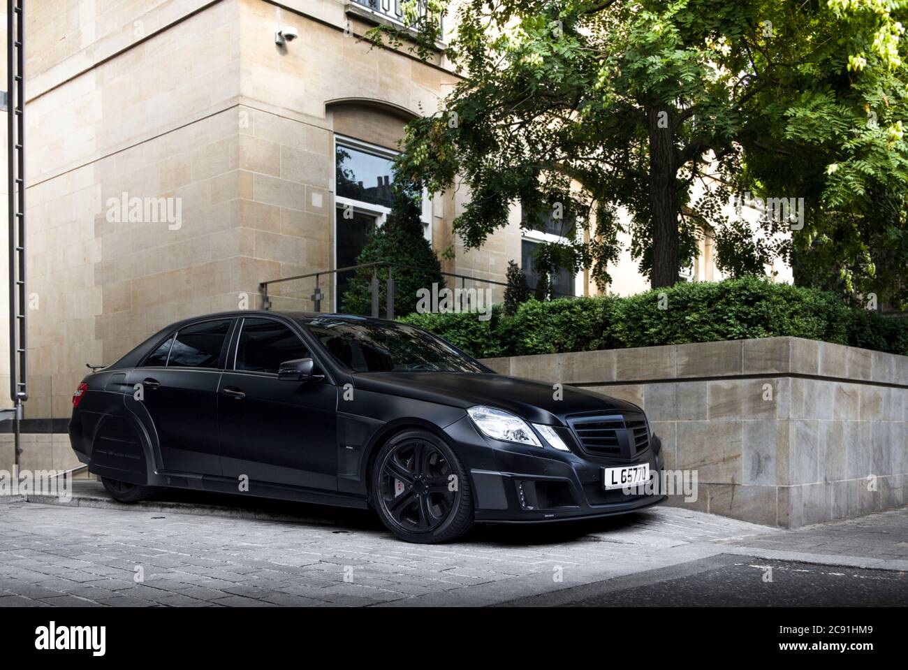 Black matte Mercedes-Benz Brabus E V12 One-of-Ten unique modified  performance saloon parked at a luxury hotel in Central London Stock Photo -  Alamy