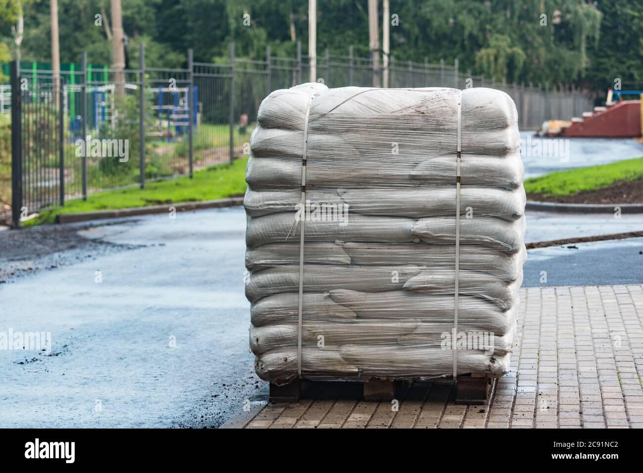 Big bags with soil on the pallet by the construction site Stock Photo