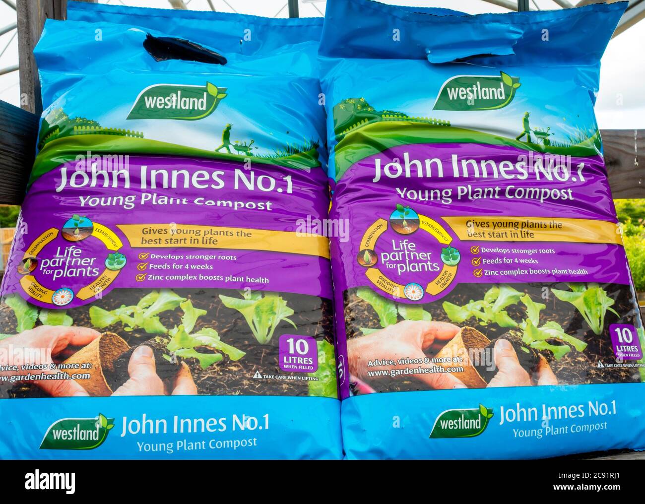 Two bags of John Innes No. 1 Young Plant Compost in a garden centre small bags easy to carry Stock Photo