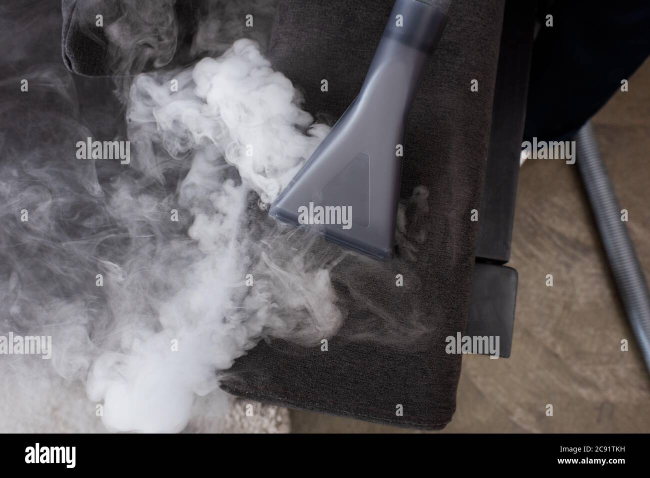 Top view of vacuum cleaner with hot steam on couch Stock Photo Alamy