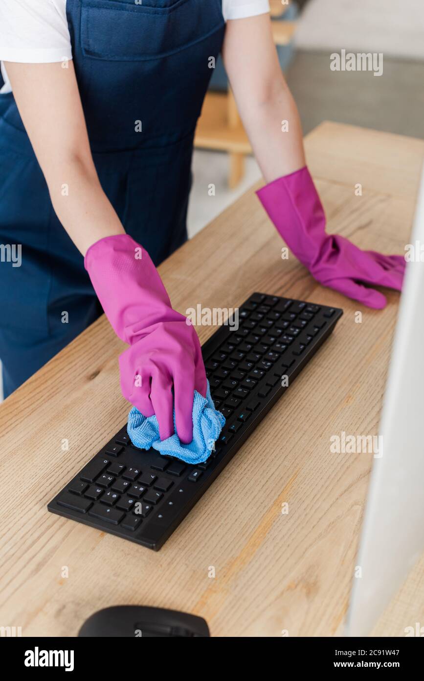 Cropped View Of Worker Of Cleaning Service Cleaning Computer Keyboard With Rag On Table Stock Photo Alamy
