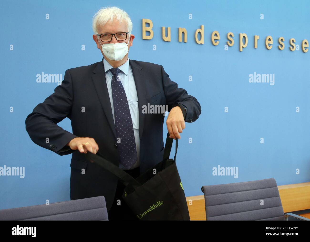 Berlin, Germany. 28th July, 2020. Jürgen Resch, Federal Managing Director of the German Environmental Aid, comes to a press conference of the German Environmental Aid with a mouth and nose protection mask to answer questions of journalists about the interim balance and their 40 complaints for clean air. Credit: Wolfgang Kumm/dpa/Alamy Live News Stock Photo