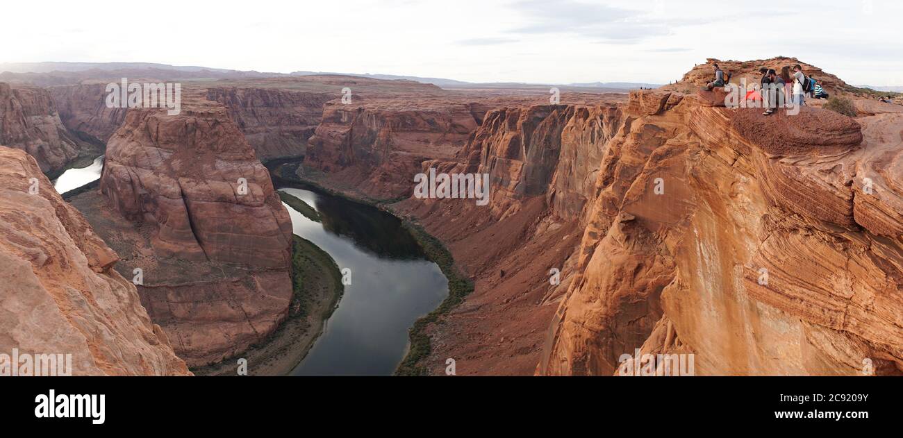 Horseshoe Bend rock formation with steep cliffs rising up from Colorado