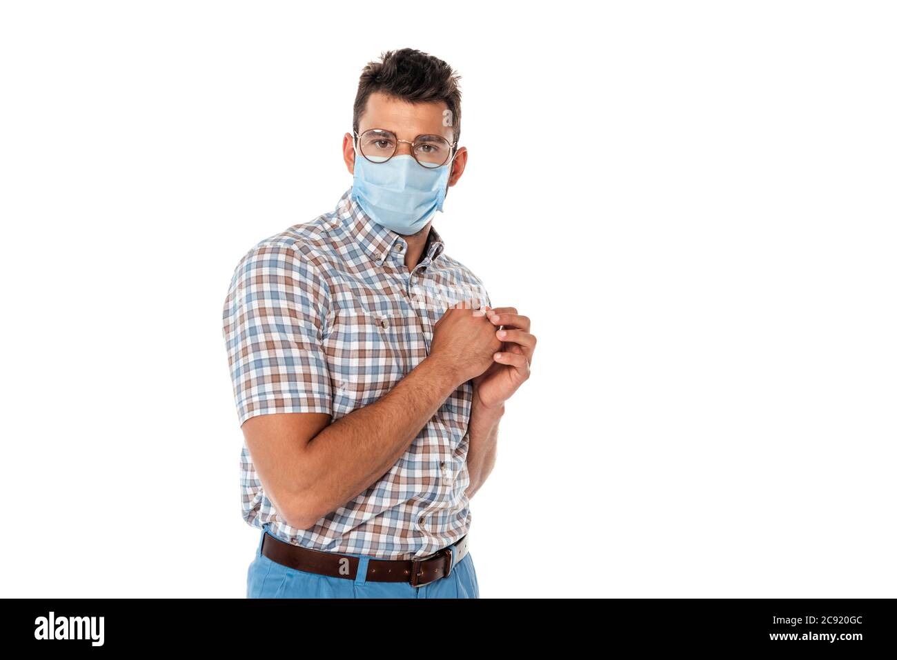 Scared nerd in medical mask looking at camera isolated on white Stock Photo  - Alamy