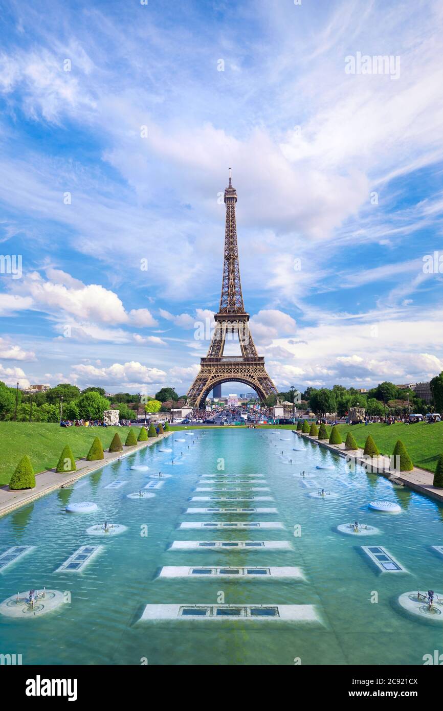 Symmetrical front panoramic view of Eiffel tower on a bright Summer day taken from fountains of Trocadero. Stock Photo