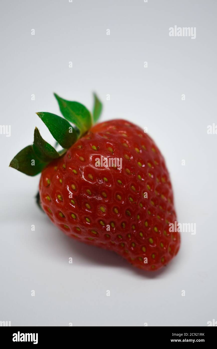Vertical shot of a strawberry isolated on a white background Stock ...