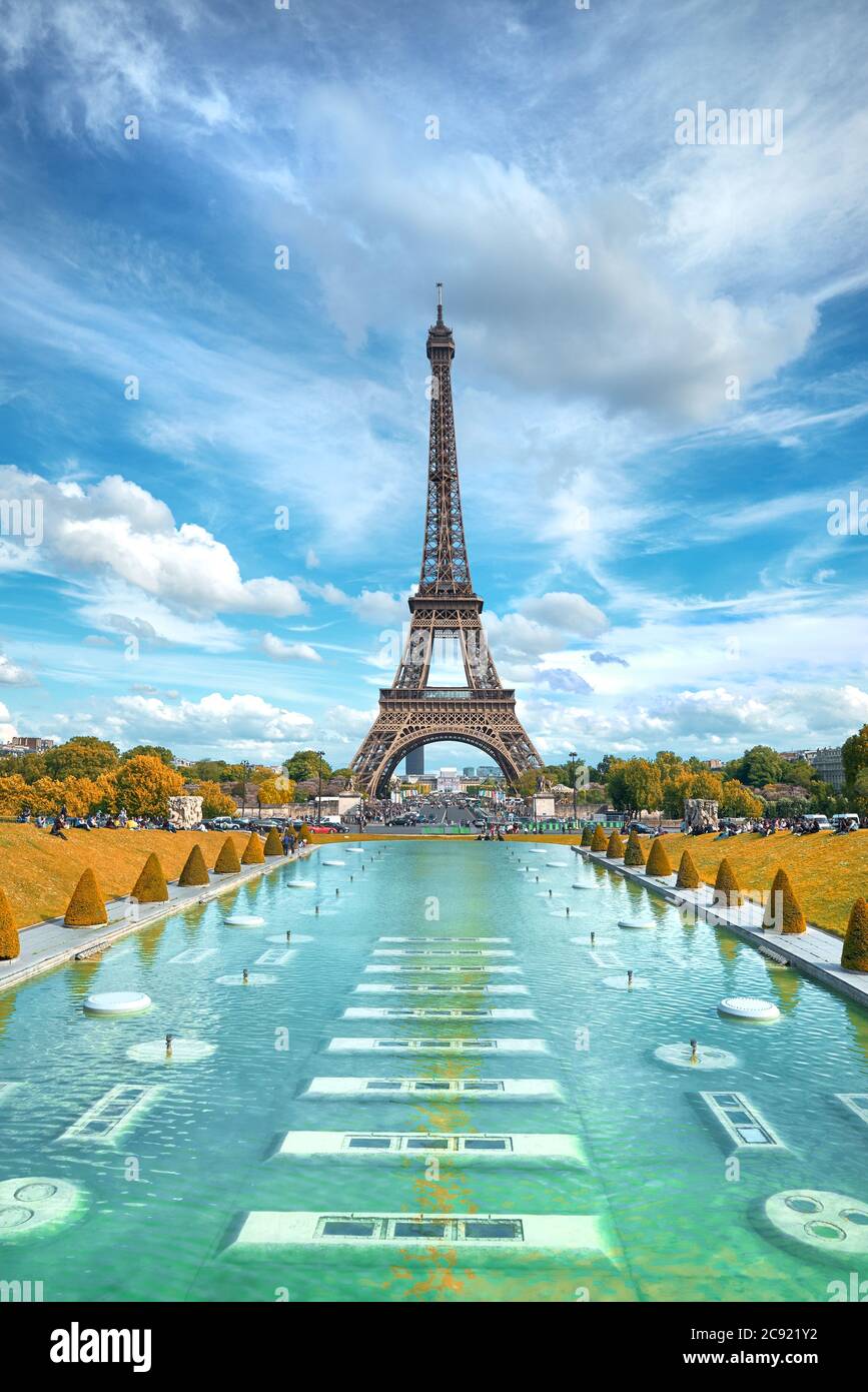 Eiffel tower, symmetrical front view from Trokadero on a bright day in Autumn with clouds in the sky Stock Photo