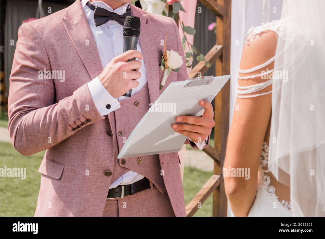 a groom with microphone at wedding ceremony Stock Photo - Alamy