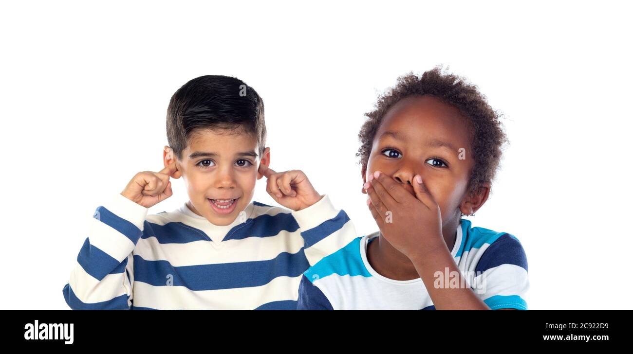 Two children excited covering the mouth and the ears isolated on a
