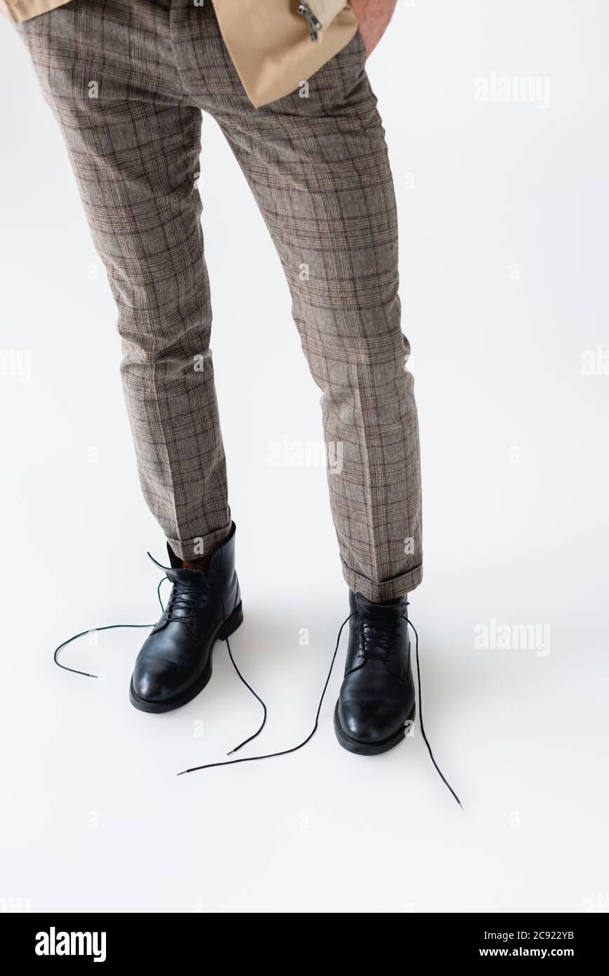 male model jumped up in a black coat in trousers and boots Stock Photo by  shotprime