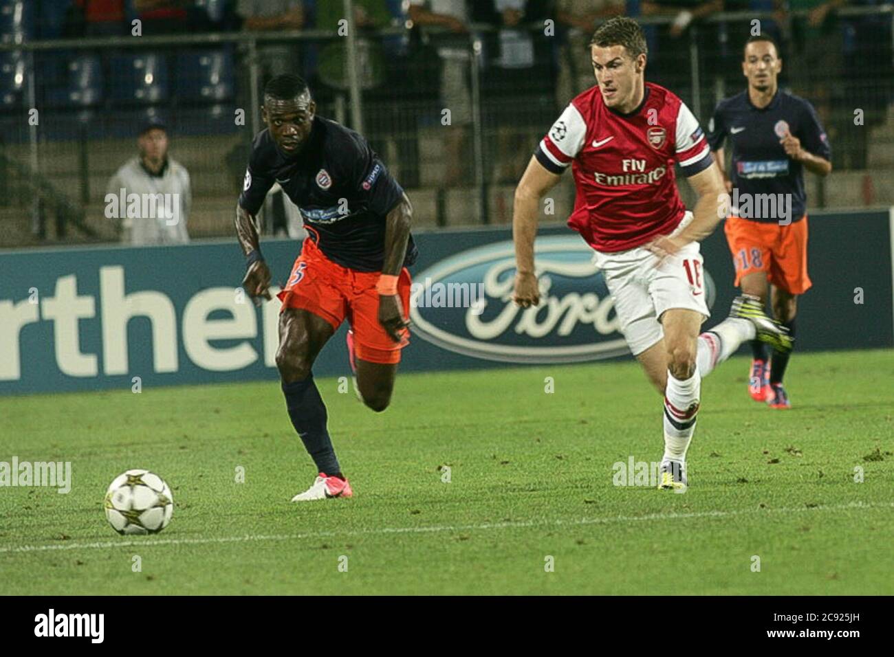 Henri Bedimo and Aaron Ramsey During the Champion League 2011 -  2012, Montpellier Herault  - FC Arsenal  on September 18 2012 in   Stade de la Mosson ,Montpellier - Photo Laurent Lairys / DPPI Stock Photo