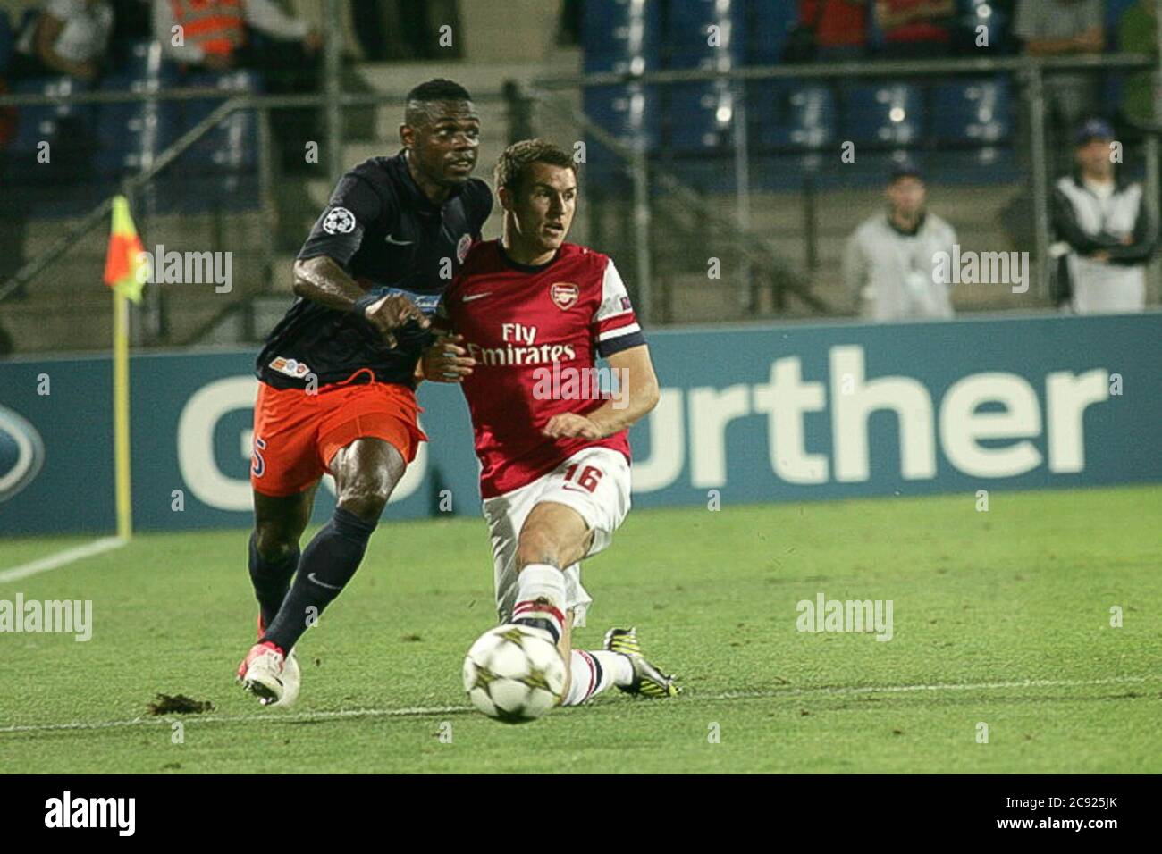 Henri Bedimo and Aaron Ramsey During the Champion League 2011 -  2012, Montpellier Herault  - FC Arsenal  on September 18 2012 in   Stade de la Mosson ,Montpellier - Photo Laurent Lairys / DPPI Stock Photo