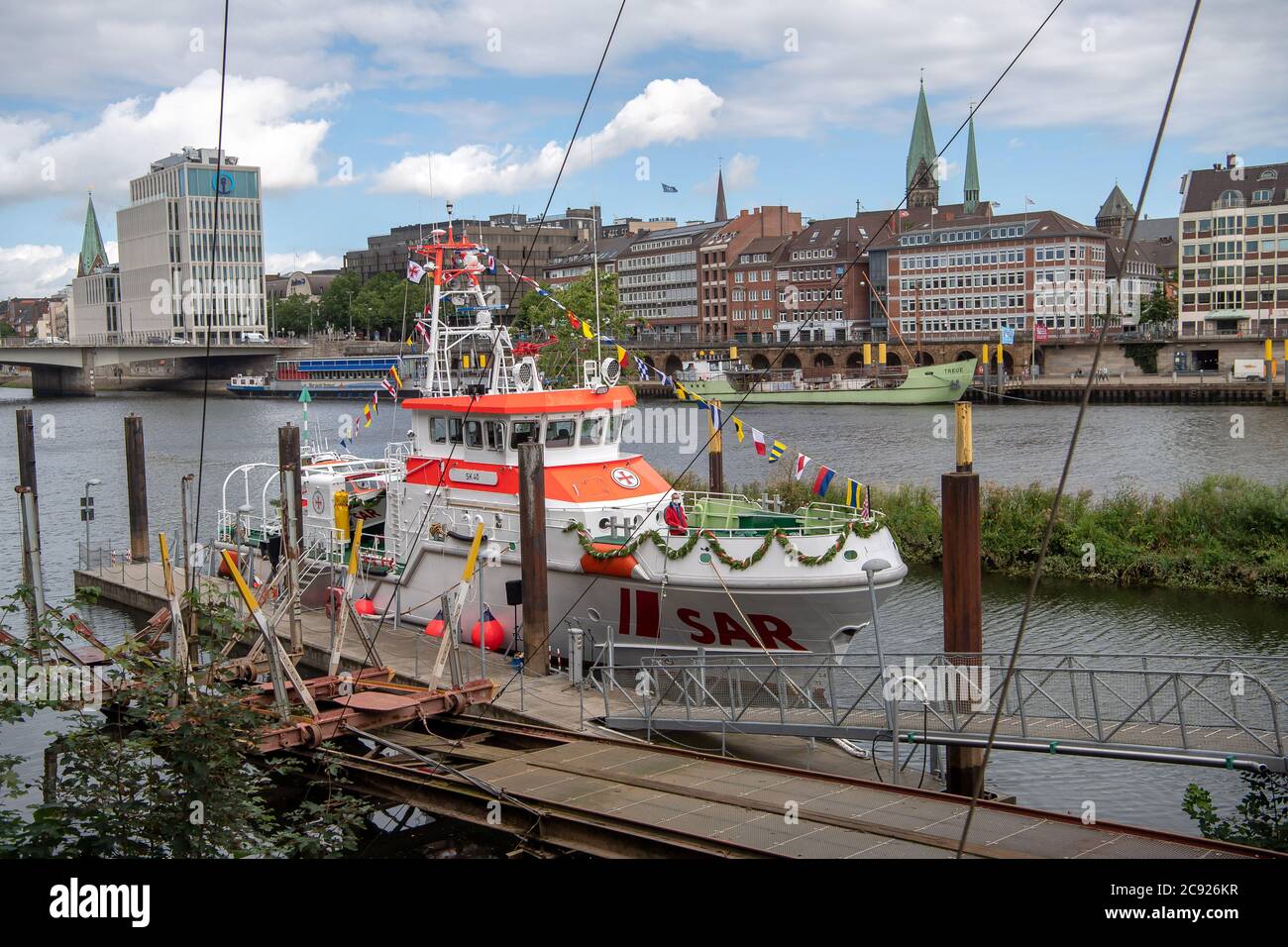Bremen, Germany. 28th July, 2020. The new sea rescue cruiser "Hamburg" of  the Deutsche Gesellschaft zur Rettung Schiffbrüchiger (DGzRS) lies in front  of the christening ceremony at the pier. The ship should