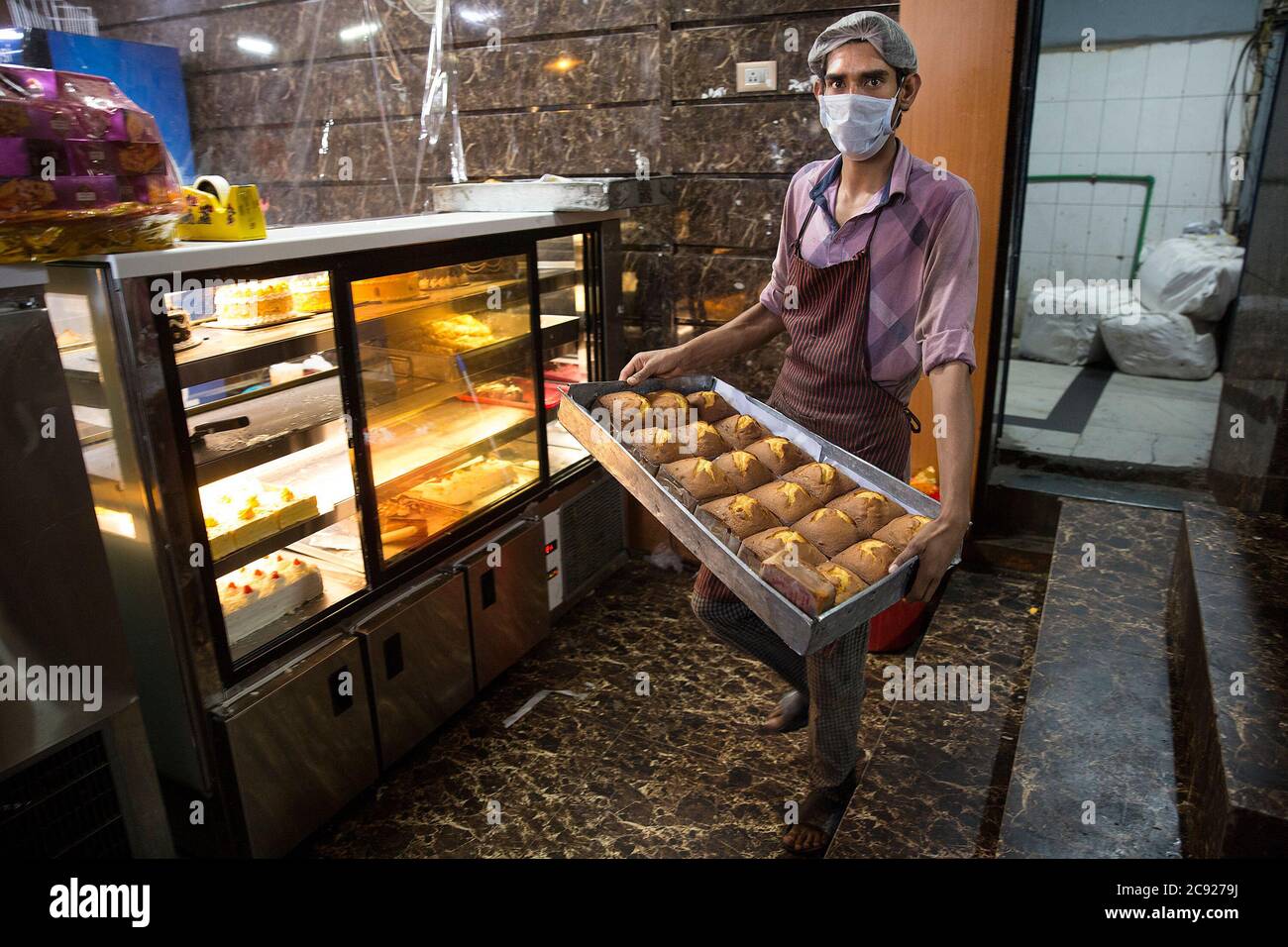 Srinagar, Indiancontrolled Kashmir. 28th July, 2020. A worker carries
