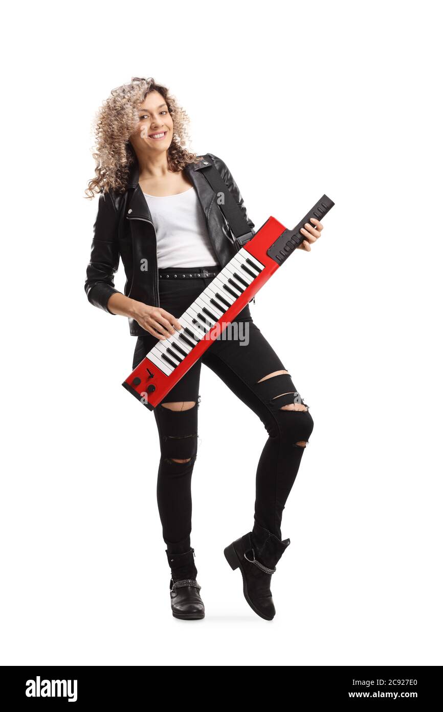 Full length portrait of a cool woman playing a keytar synthesizer and smiling isolated on white background Stock Photo