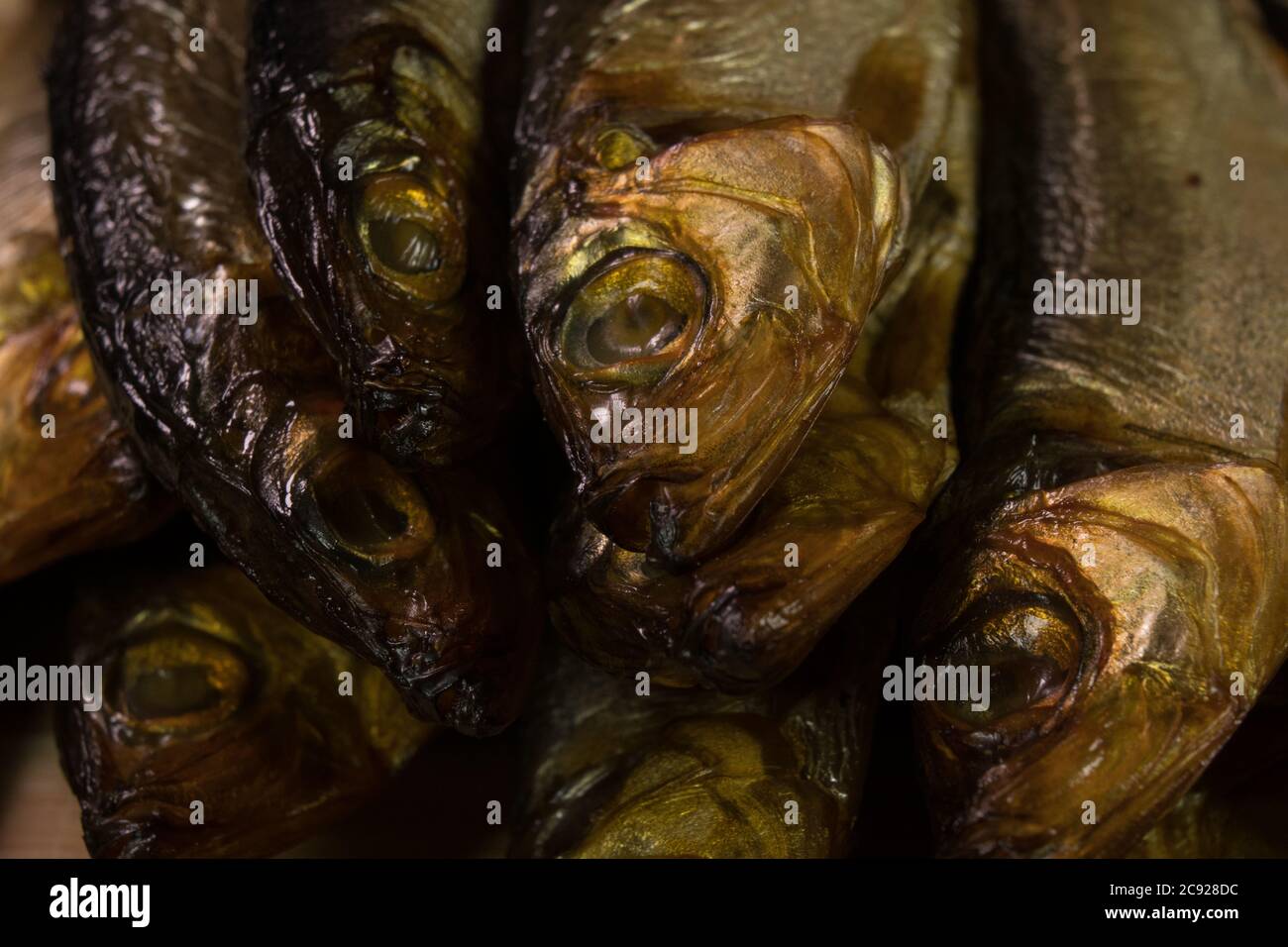 background of golden smokedried fish close up Stock Photo Alamy