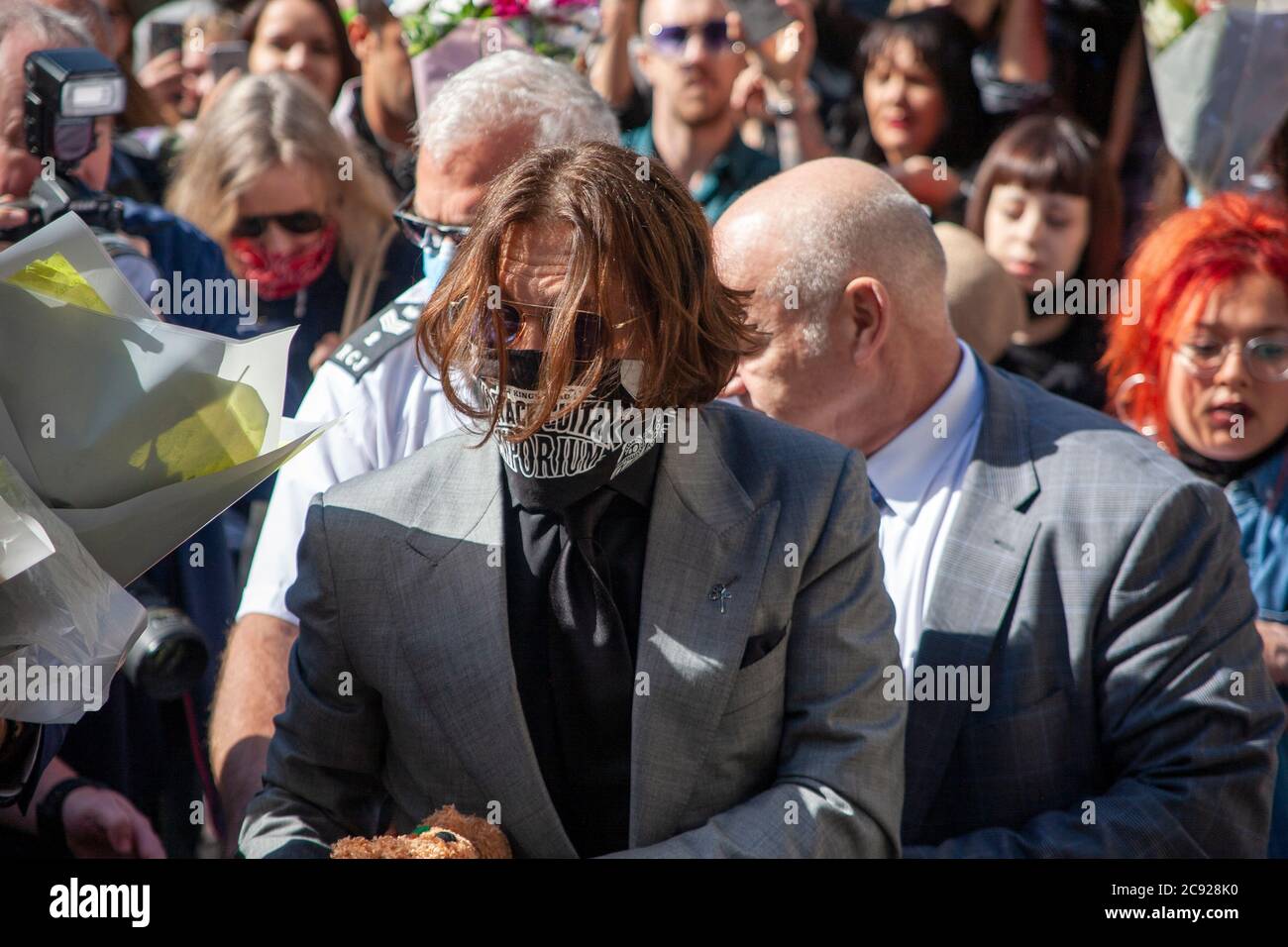 London, UK. 28th July 2020. Hollywood actor and musician, Johnny Depp, arrives at the high court on day 16 of his libel trial against The Sun's publishers NGN. Credit: Neil Atkinson/Alamy Live News Stock Photo