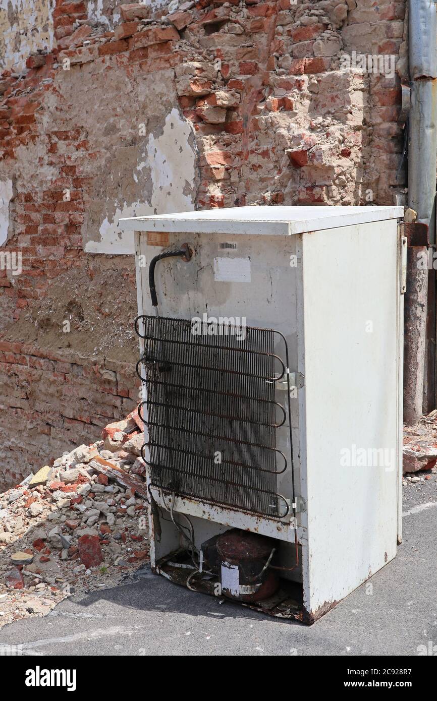 Old broken fridge on the street next to a house under demolition Stock  Photo - Alamy