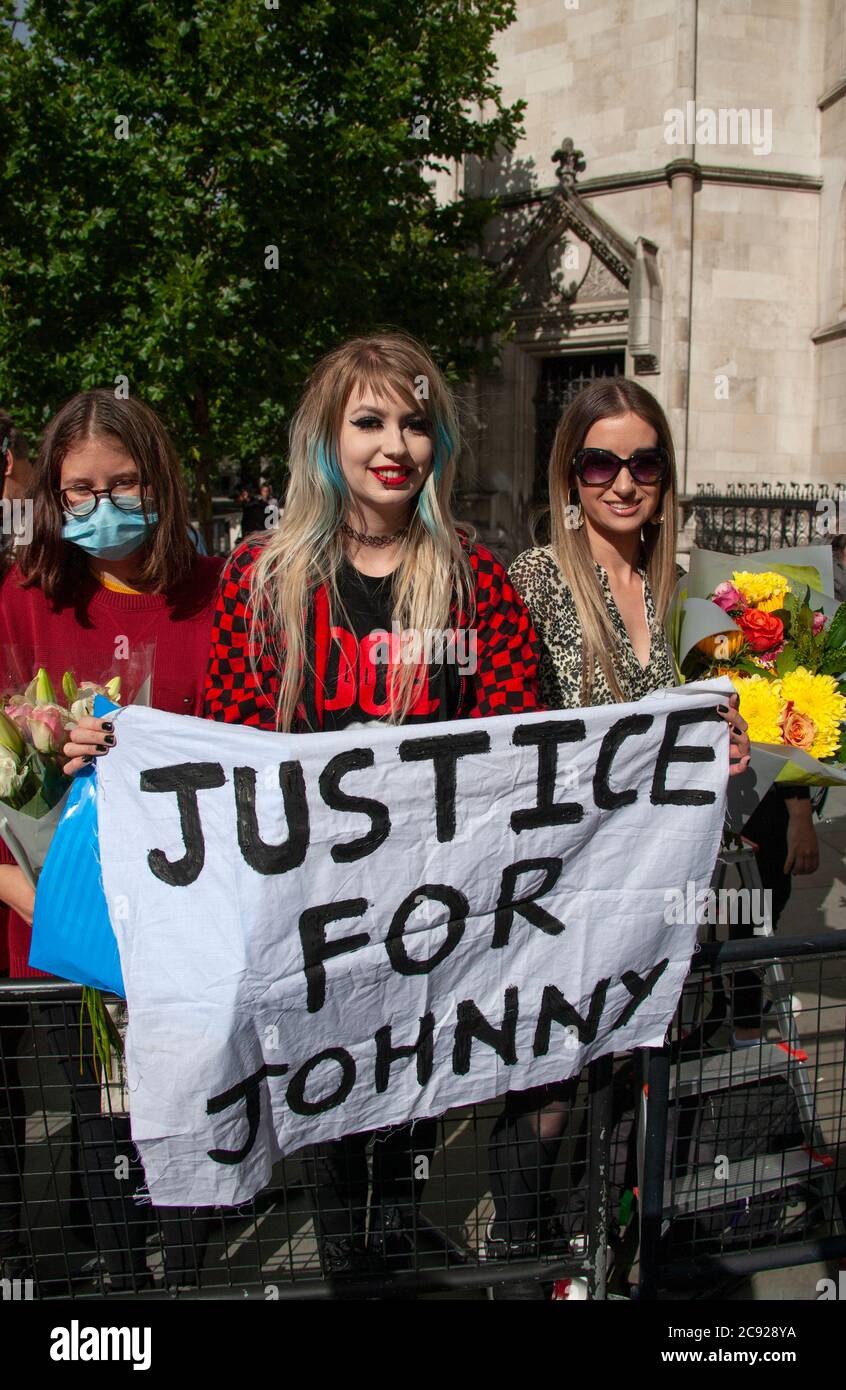 London, UK. 28th July 2020. Johnny Depp fan, Charlotte Pitson, holds up a ‘JUSTICE FOR JOHNNY’ banner, outside The Royal Courts of Justice, on the last day (16) of the actors libel trial against The Sun's publishers NGN. Credit: Neil Atkinson/Alamy Live News Stock Photo