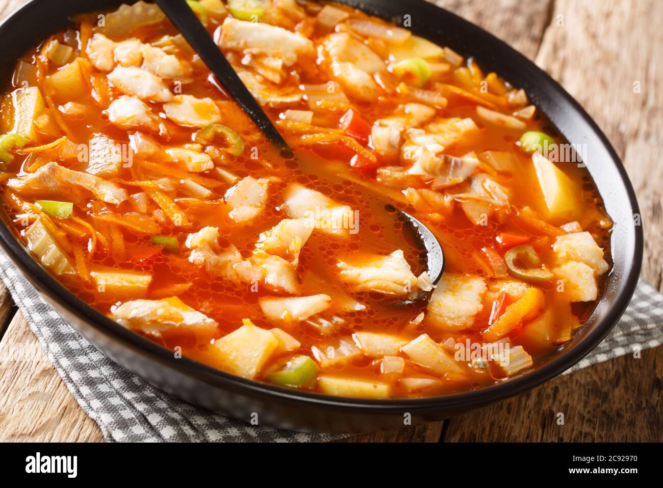 Delicious robust tomato based fish Bermuda Fish Chowder closeup in the