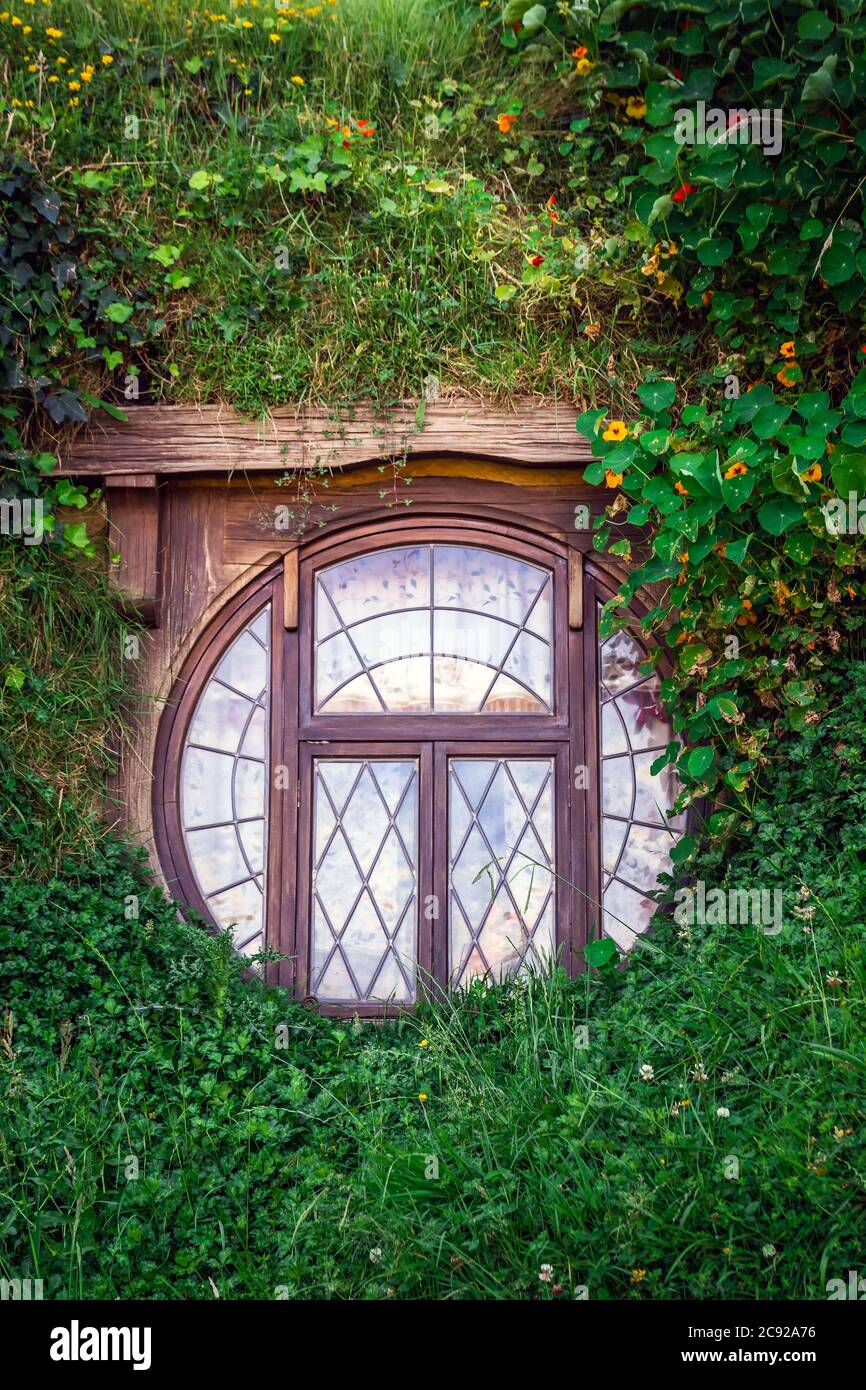 Window of the house at the Hobbiton, New Zealand. The place where hobbits live in their holes. Stock Photo