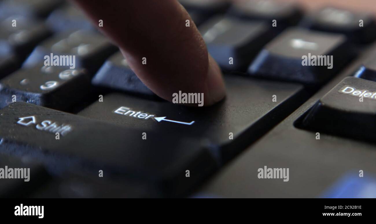 Black computer keyboard super close up stock footage. Black computer enter keys Stock Photo