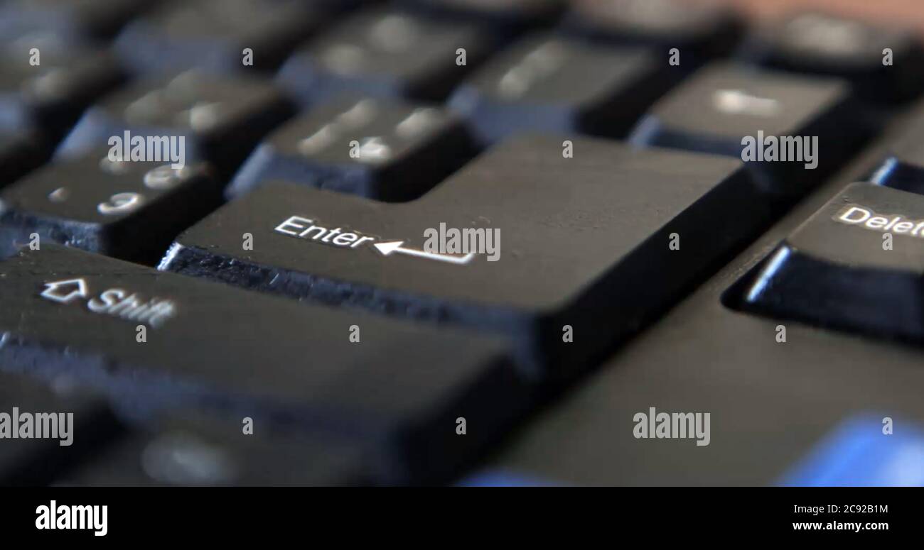 Black computer keyboard super close up stock footage. Black computer enter keys Stock Photo