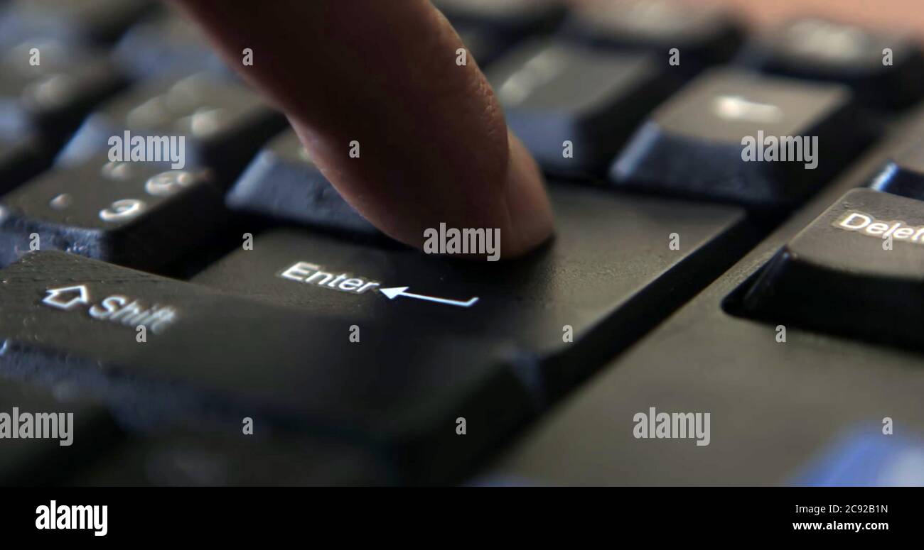 Black computer keyboard super close up stock footage. Black computer enter keys Stock Photo