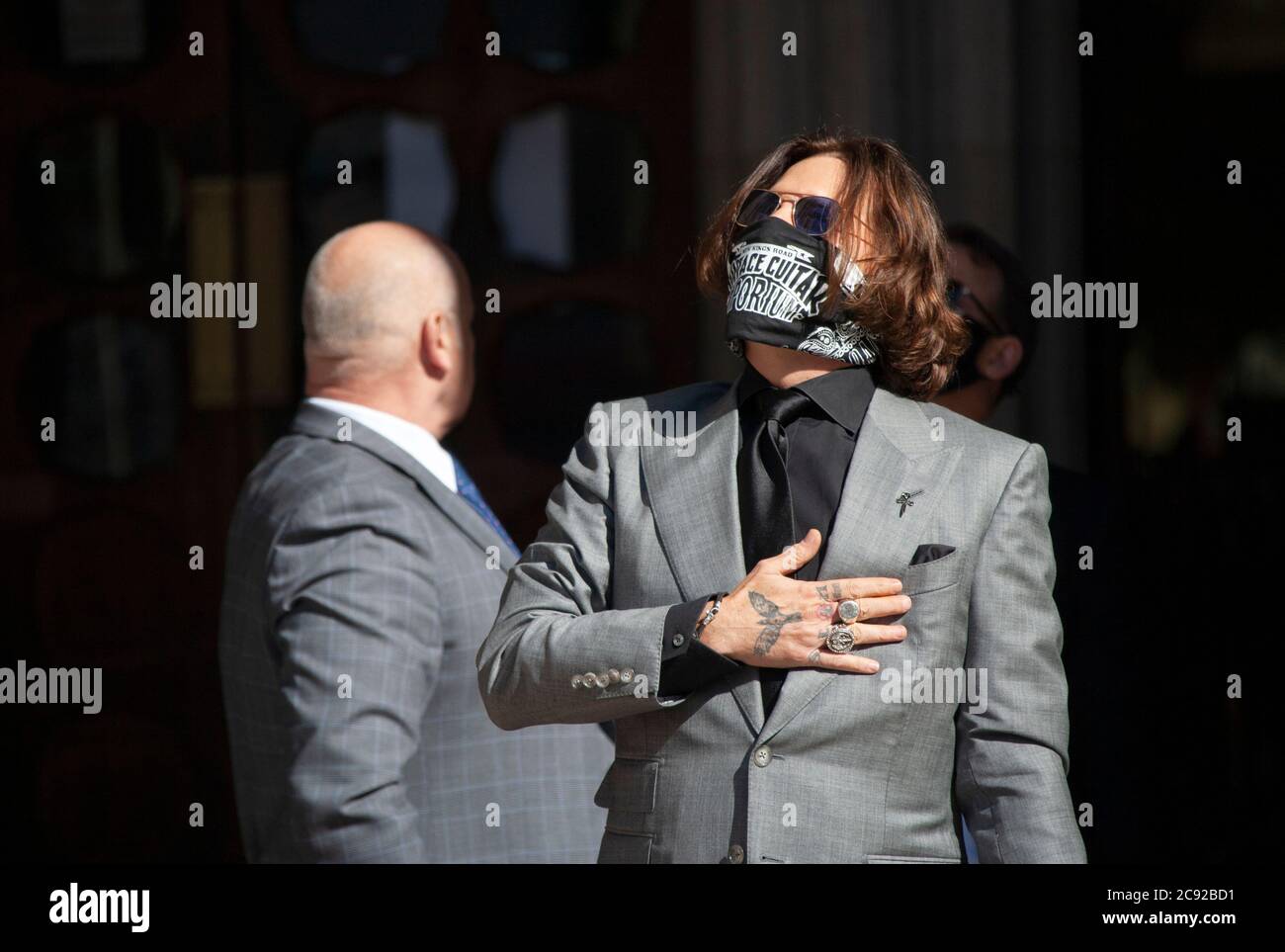 London, UK. 28th July 2020. Hollywood actor and musician, Johnny Depp, arrives at the high court, wearing a face scarf, on day 16 of his libel trial against The Sun's publishers NGN. Credit: Neil Atkinson/Alamy Live News Stock Photo