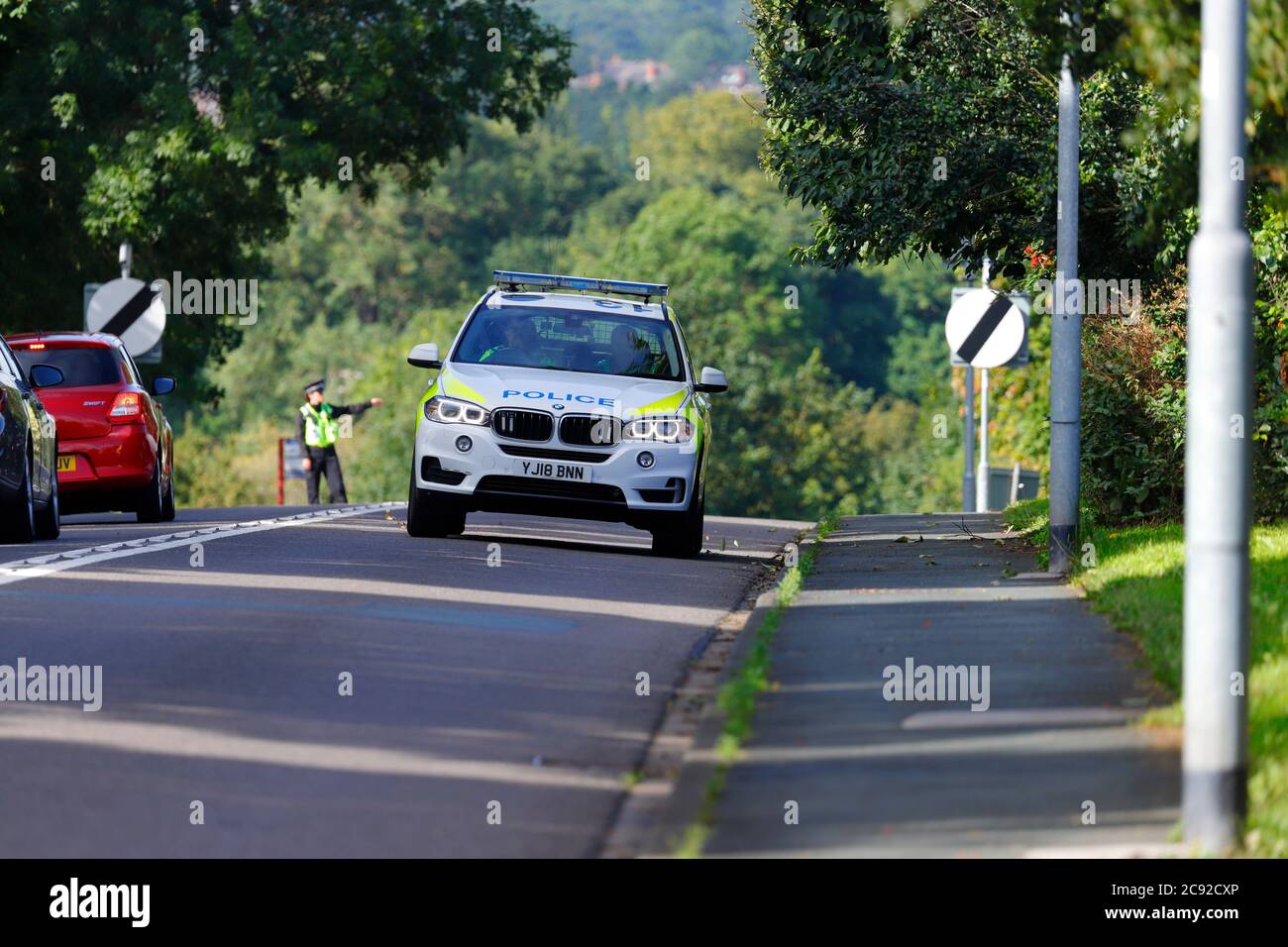 A police BMW X5 leaving the scene of an accident on Wakefield Road in Swillington. Stock Photo