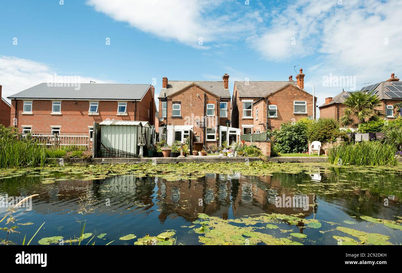 Urban houses on a canal bank Stock Photo Alamy
